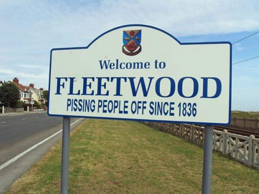 Welcome sign for Fleetwood featuring a humorous slogan.