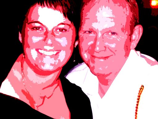 A smiling couple in bright, stylised colours against a dark background.