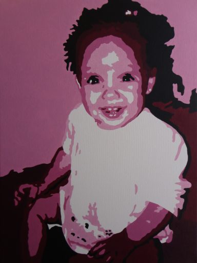 A smiling baby with curly hair, wearing a light-coloured top against a pink background.