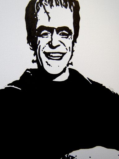 A smiling cartoonish Frankenstein character in black and white.